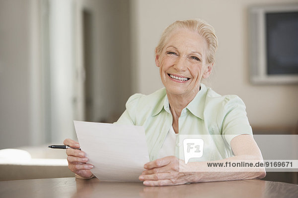 Senior Caucasian woman reading letter