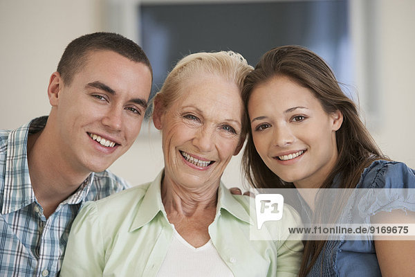 Caucasian mother and children smiling together