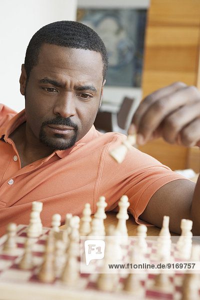 African American man playing chess
