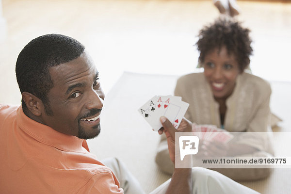 African American couple playing cards