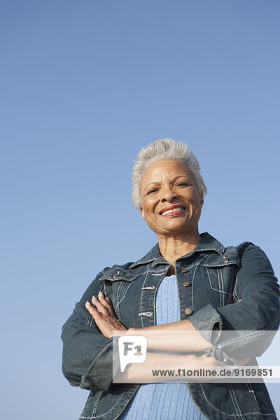 Senior African American woman standing outdoors