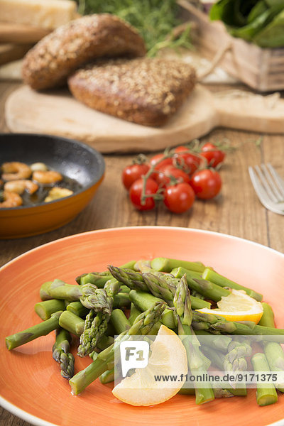Mediterranean low carb dish with green asparagus and shrimps