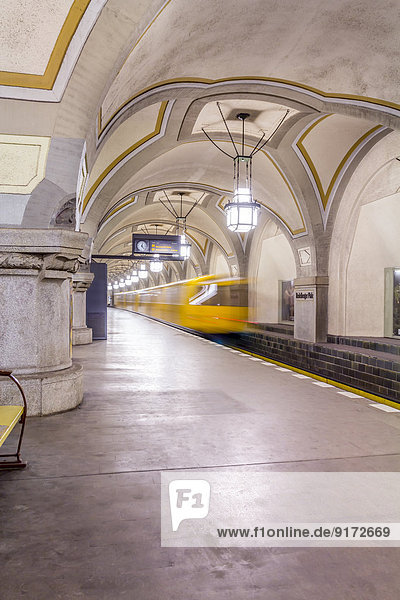 Germany Berlin historic subway station Heidelberger Platz with moving underground train