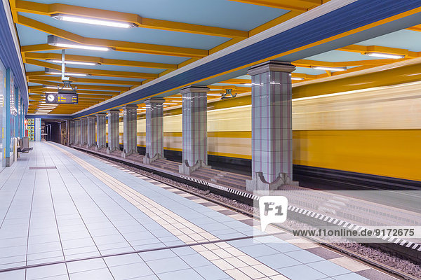 Germany  Berlin  subway station Lindauer Allee with moving underground train