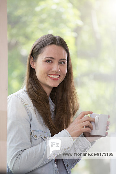 Portrait of creative business woman having coffee break