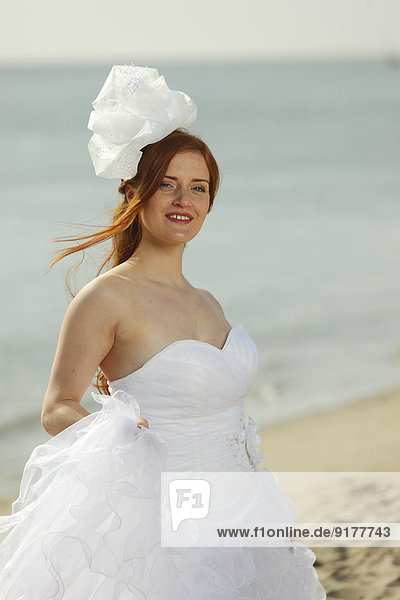 Netherlands  Texel  De Cocksdorp  woman in bridal gown at the beach