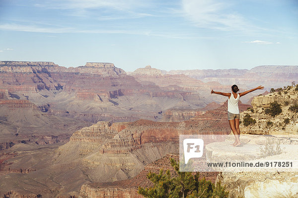 USA  Arizona  woman enjoying the view at Grand Canyon  back view