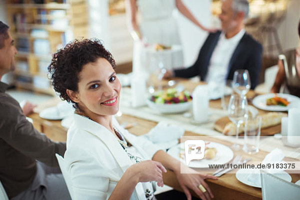 Woman smiling at dinner party