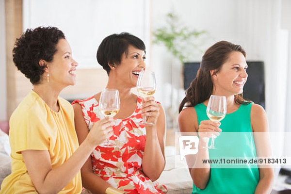 Women drinking wine together