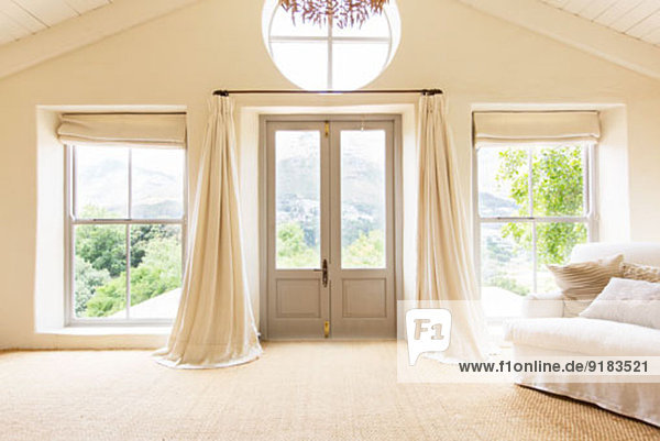 Curtains and front doors of rustic house