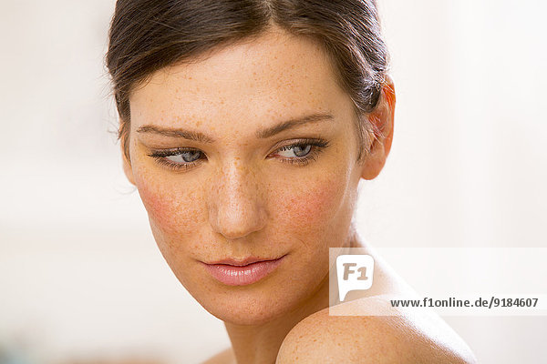 Caucasian woman looking over her shoulder