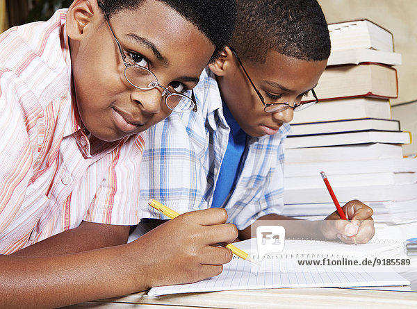 Mixed race boys doing their homework