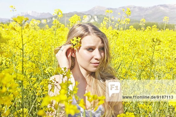 Young woman with yellow flower in hair  portrait