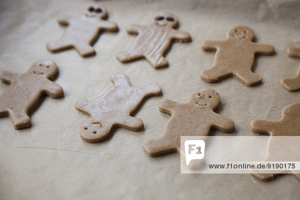 Close-up of gingerbread cookies on baking sheet