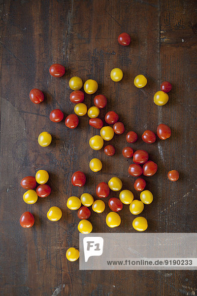 Directly above shot of cherry tomatoes on wooden table