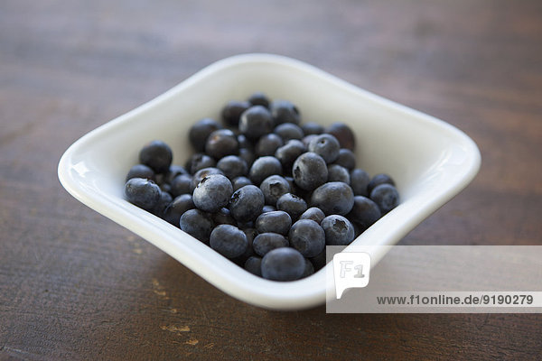Close-up of blueberries in bowl on table
