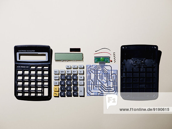 Calculator parts over white background