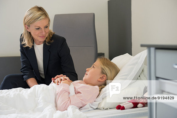 Mother visiting daughter in hospital