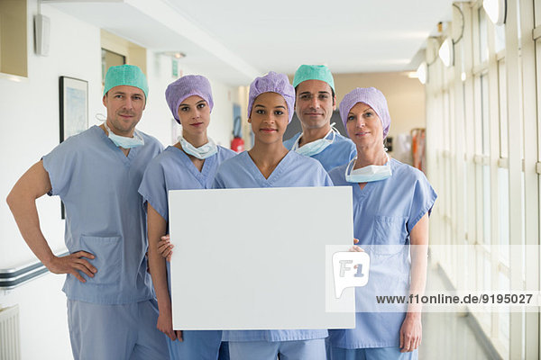 Medical team holding a whiteboard