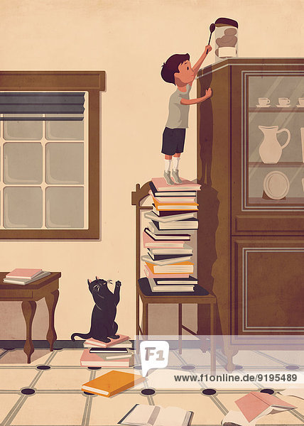 Junge steht auf einem Stapel Bücher und versucht ein Keksglas zu erreichen
