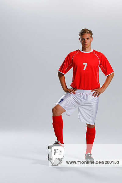 Soccer Player Standing With Ball