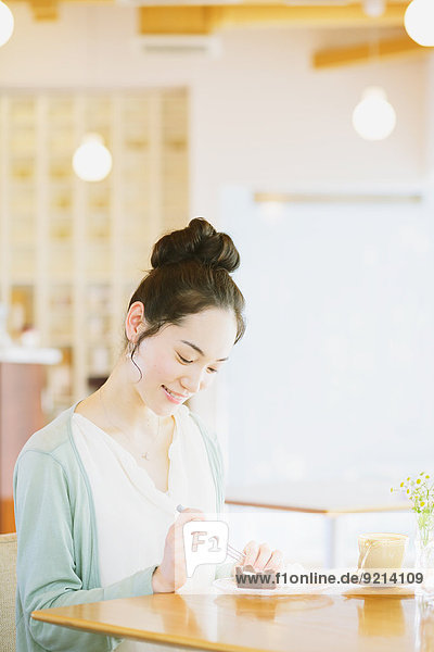 Japanese woman relaxing in a cafe