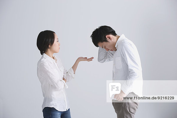 Young Japanese couple having an argument