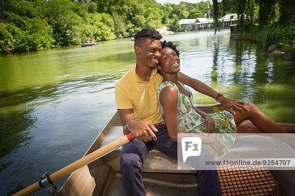 Young couple on rowing lake in Central Park  New York City  USA