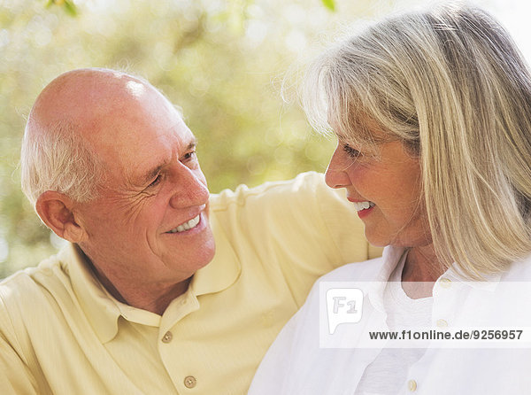 Senior couple smiling to each other