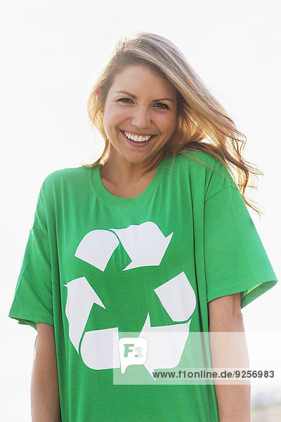 Front view of woman wearing green t-shirt