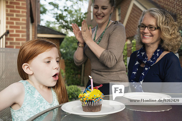 Three generations of Caucasian women celebrating birthday