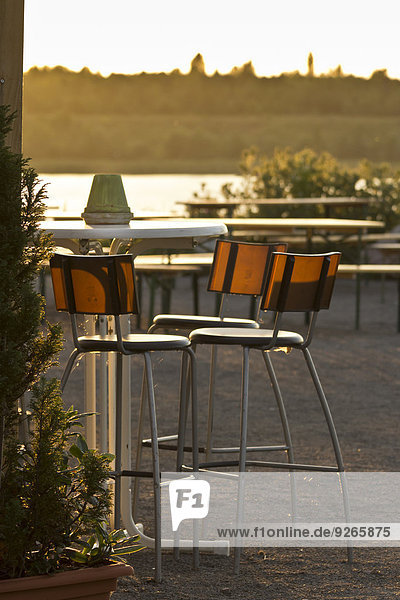 Saxony  empty chairs in a beer garden at evening twilight