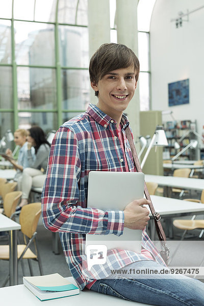 Portrait of student in a university library