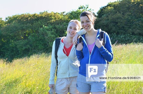 Portrait of two young women in field