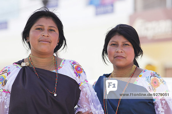 Two indigenous young women  15 and 17 years  indigenas in traditional costume  Otavalo  Imbabura Province  Ecuador