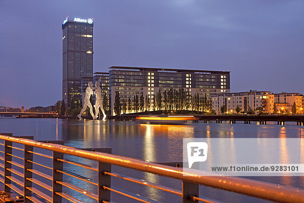 Molecule Man  artwork by American sculptor Jonathan Borofsky  and Treptowers building complex on the River Spree  Treptow  Berlin  Germany