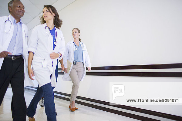 Doctors and nurses in hospital hallway