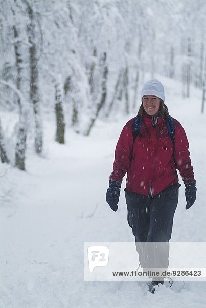 Smiling woman walking at winter