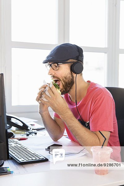 Mid adult man working in office