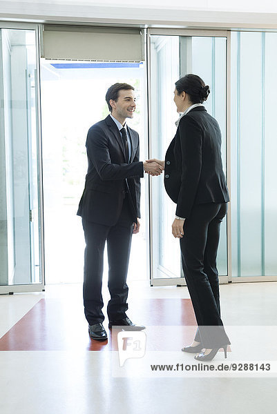 Business associates shaking hands