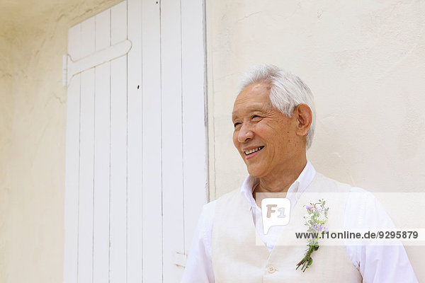 Senior adult Japanese man smiling