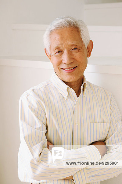 Senior adult Japanese man smiling