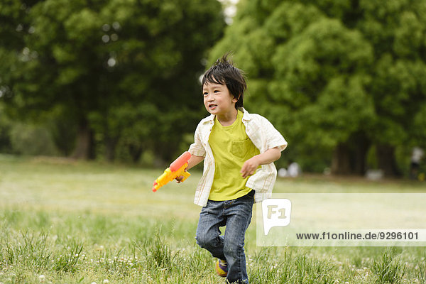 Young Japanese kid playing in a park