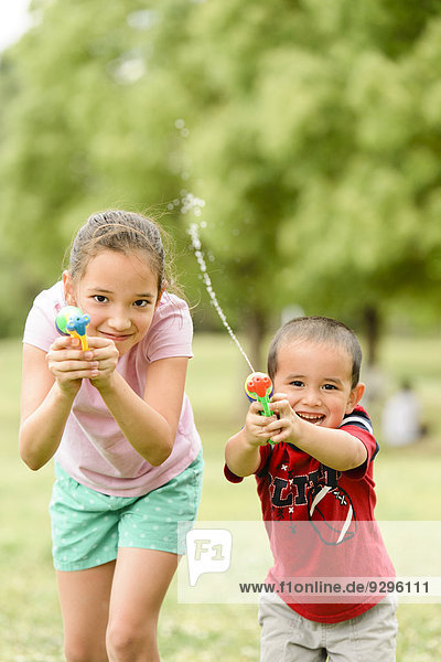 Young Japanese kids playing in a park