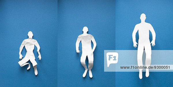 Collage des Papiermenschen mit Lebensphasen auf blauem Hintergrund