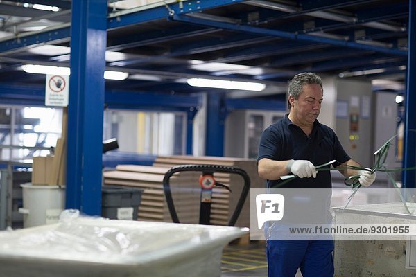 Senior man working in factory