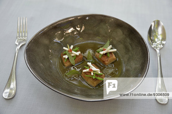 Miso soup with foie gras  vegetables and Japanese Ume fruits served in the Sant Pau Restaurant  three Michelin Stars  created by Michelin Star chef Carmen Ruscalleda  Sant Pol de Mar  Catalonia  Spain