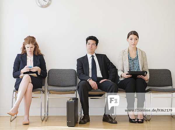 Business people in office waiting room