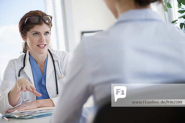 Doctor and patient talking in office