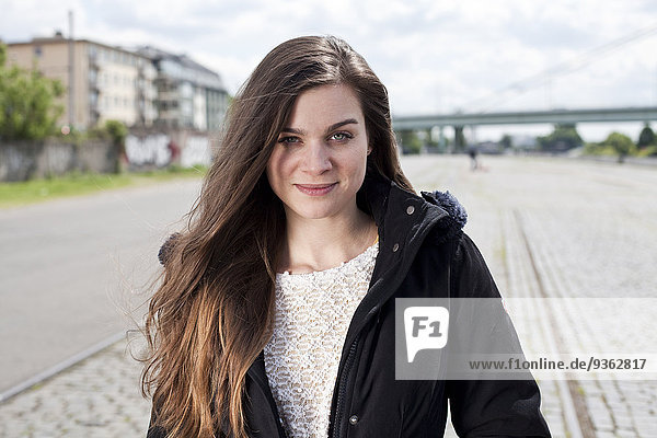 Germany  North Rhine-Westphalia  Cologne  portrait of smiling young woman